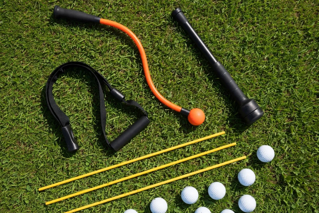 Golf swing training aids arranged on grass